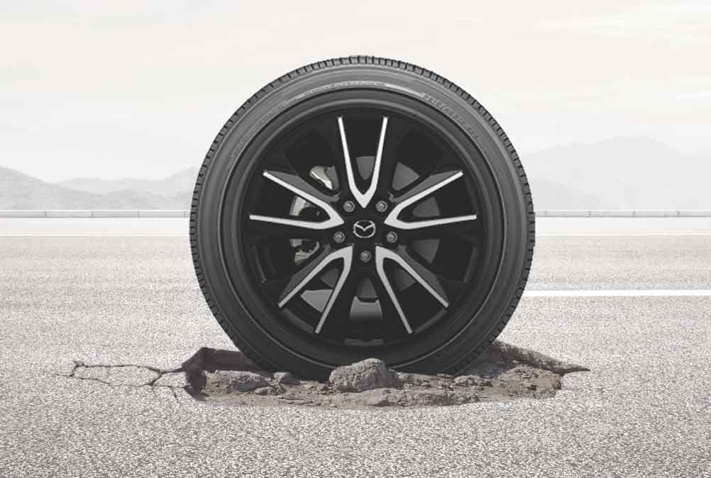 Mazda Wheel and Tire in Pothole
